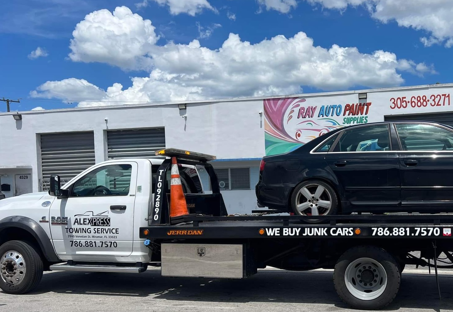 Alexpress tow truck on a local Florida road